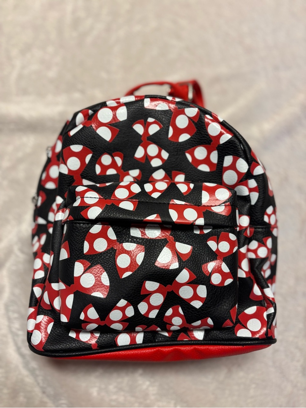 Disney Mini Backpack in Black with Red & White Bow Pattern
